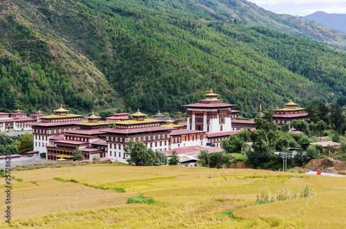 Tashichho Dzong, also known as Dzong of Thimphu, in Thimphu the capital of Bhutan. Paddy test area in the foreground.