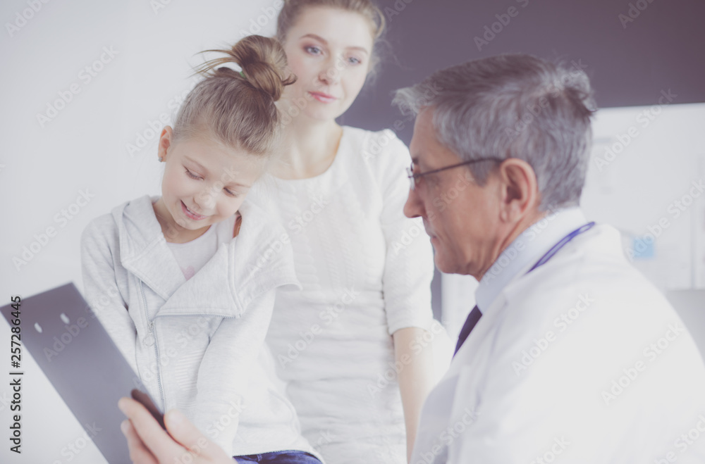 Little girl with her mother at a doctor on consultation Little girl with her mother at a doctor on consultation