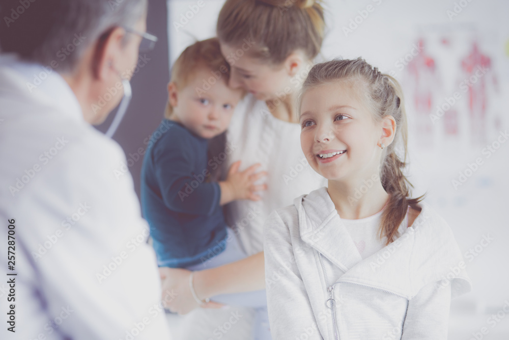 Little children with her mother at a doctor on consultation Little children with her mother at a doctor on consultation