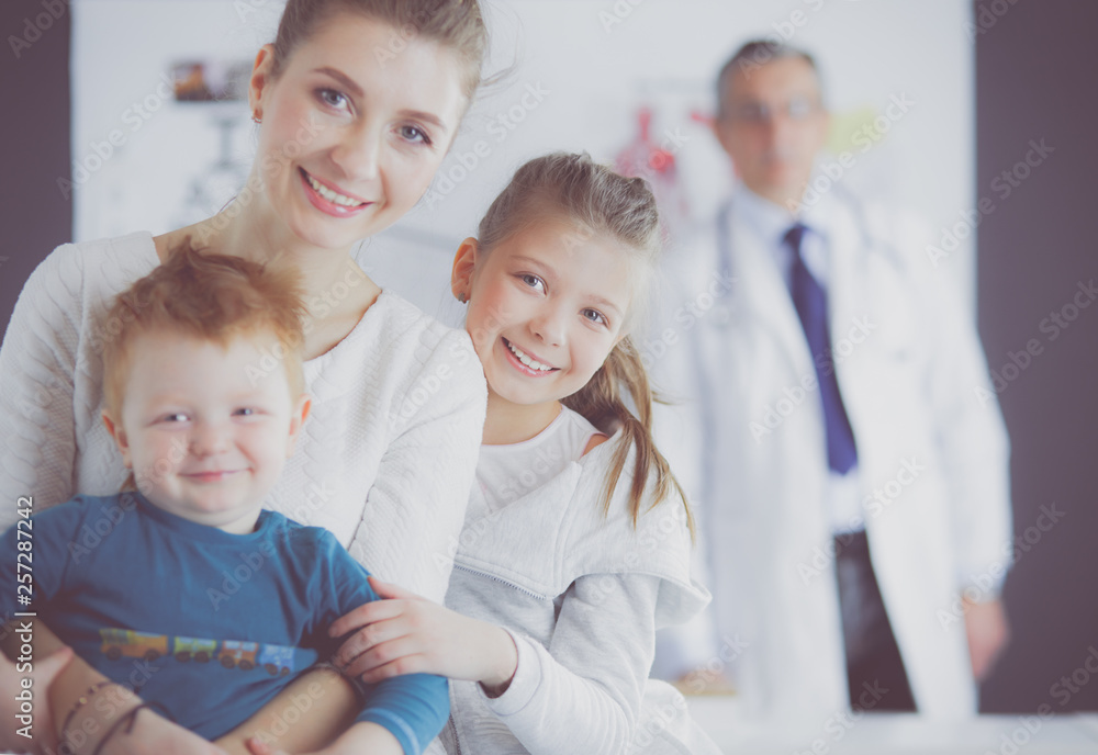 Little children with her mother at a doctor on consultation