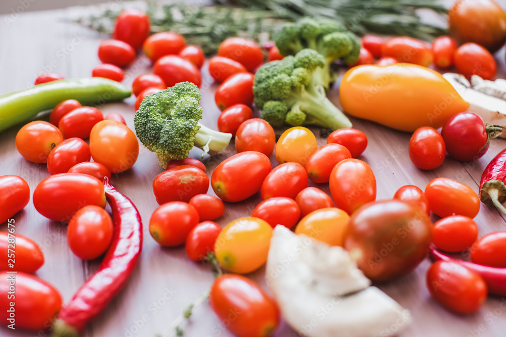 Fresh vegetables on a wooden table close-up.