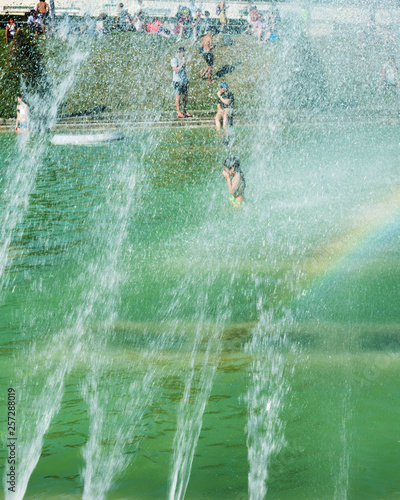 Paris is hot and people are swimming in the pool from the fountain in front of the Eiffel Tower, Paris, France, on August 2, 2018.