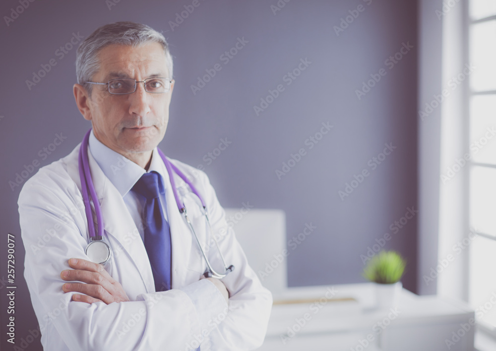 Portrait of a smiling doctor in his bright office Portrait of a smiling doctor in his bright office