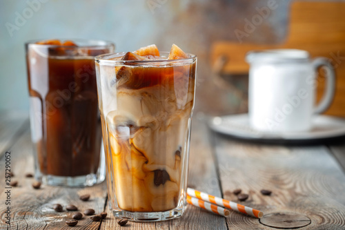 Foto Ice coffee in a tall glass with cream.