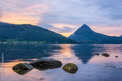 colorful sunset over the fjord on Senya island in Norway photo