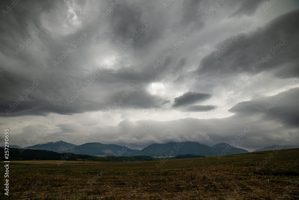 Obraz premium storm clouds over fields in slovakia