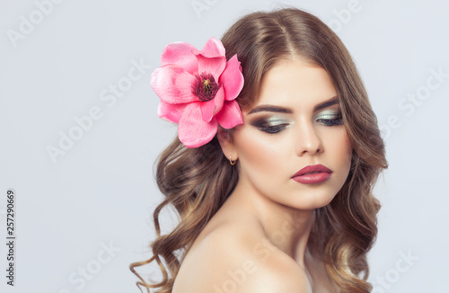 Portrait of a woman with beautiful make-up and hairstyle. Professional makeup and skin care.