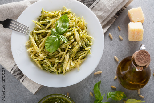 Quadro em tela Traditional trofie pasta with pesto sauce on white plate