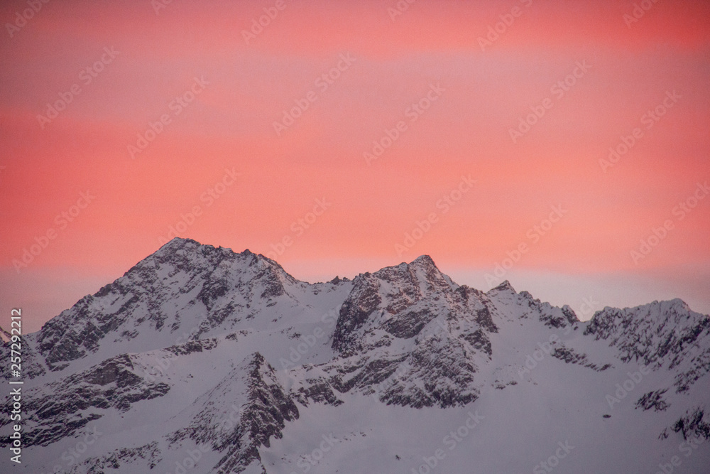 pink clouds above mountain