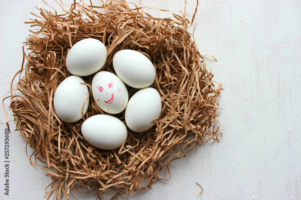 White eggs in a nest of straw. Easter. Copy space for text. White eggs in a nest of straw. Easter. Copy space for text.