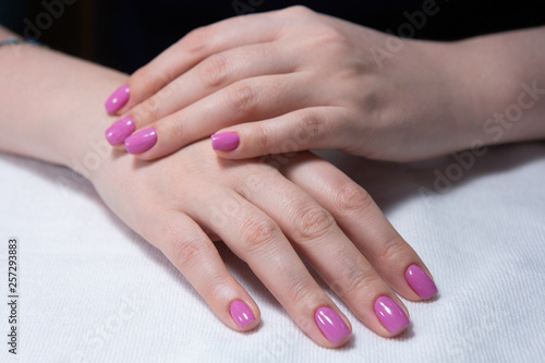 Hands with beautiful nails painted bright  manicure