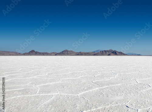 Panoramic view of the stark white Bonneville Salt Flats with mountains in the distance photo