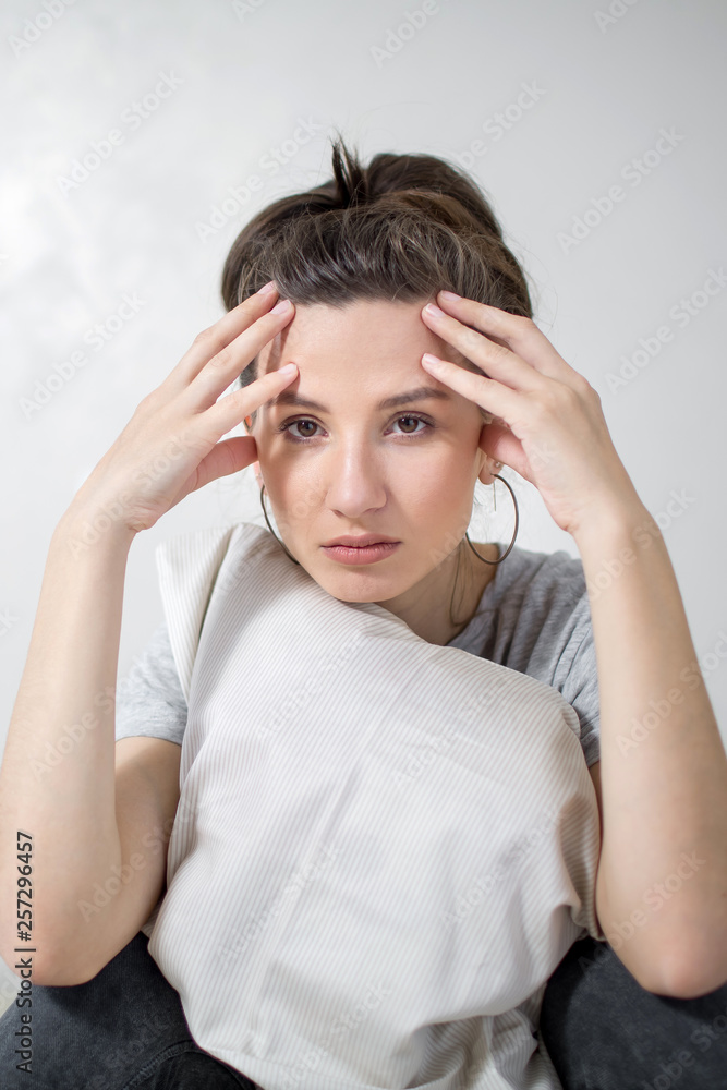Portrait of beautiful woman has headaches. White background Portrait of beautiful woman has headaches. White background