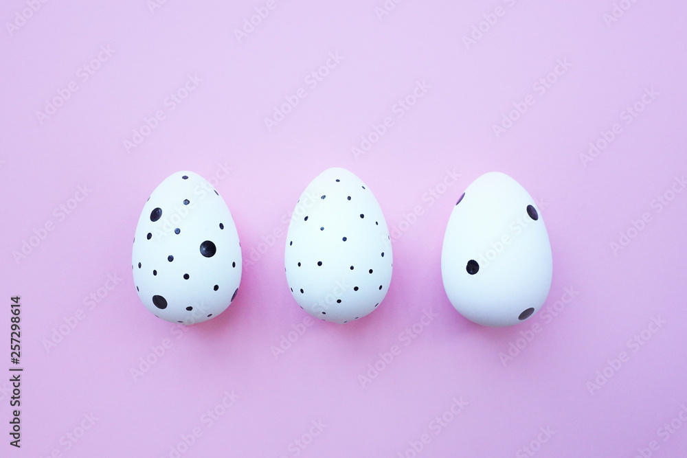 White three easter eggs on pink background. Background with easter eggs.
