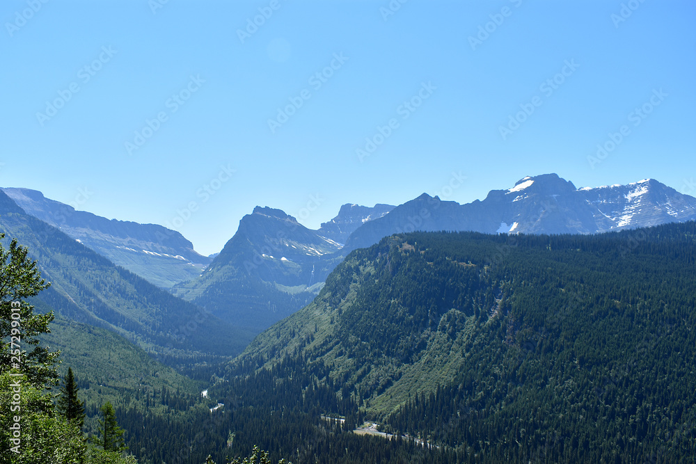 Mountain Range and Green Valley with Trees and a River Winding Through, Going-to-the-Sun Road, Glacier National Park, Montana