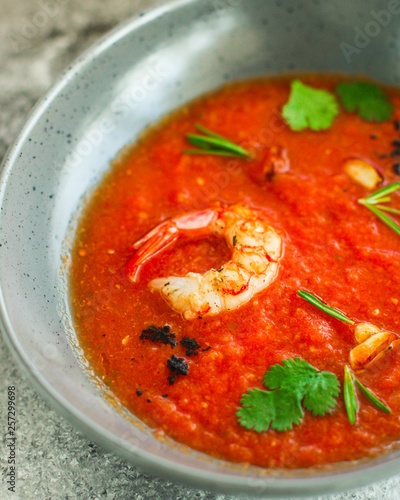 Gazpacho soup with prawns shrimps (tomato red soup with seafood) portion. food background. copy space