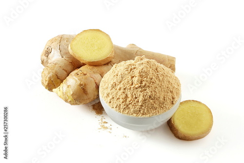 Fresh ginger root and ginger powder isolated on white background photo