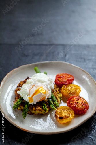 Courgette rosti, poached egg, asparagus and roast tomatoes