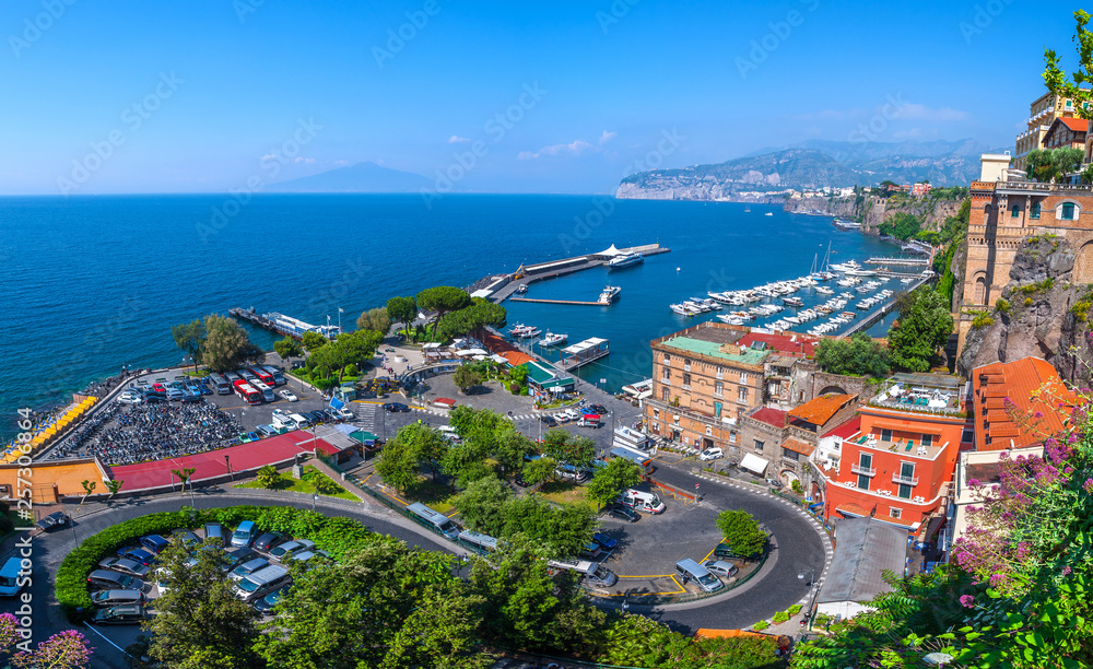 Seascape beautiful famous coastline. Yachts, boats and boats in the harbor. Seaside panoramic view of Sorrento, Naples, Campania, Italy.