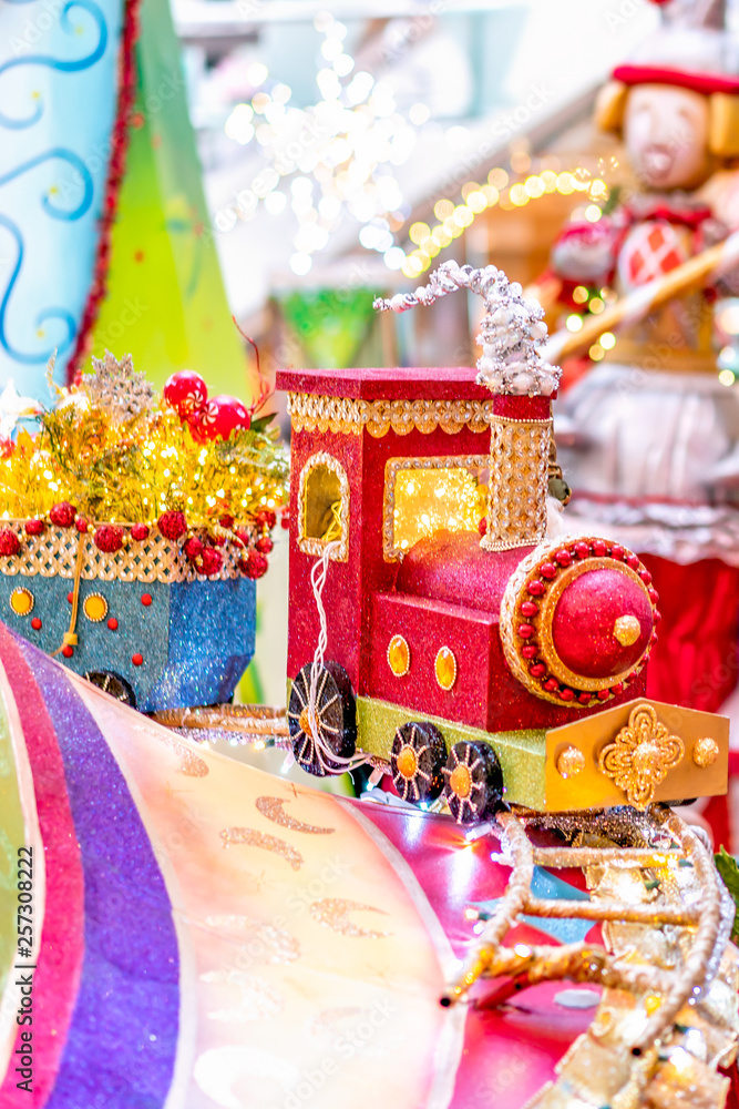 Fototapeta premium Colorful Christmas train decoration with lights background