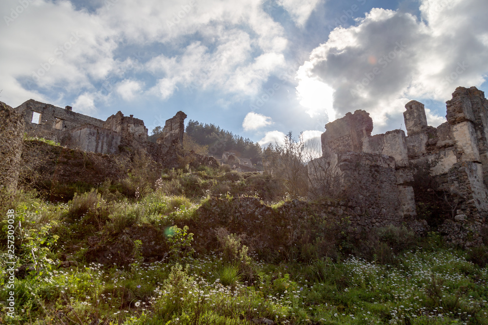 The abandoned Greek Village of Kayakoy, Fethiye, Turkey. Old greek houses, kaya koy near Mediterranean coast. The abandoned Greek Village of Kayakoy, Fethiye, Turkey. Old greek houses, kaya koy near Mediterranean coast.