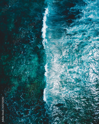 Aerial shot of a wave in the ocean