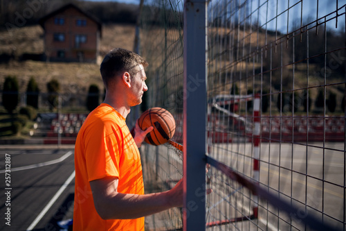 Basketball player at street court © Novak