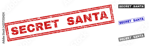 Grunge SECRET SANTA rectangle stamp seals isolated on a white background. Rectangular seals with grunge texture in red, blue, black and grey colors.