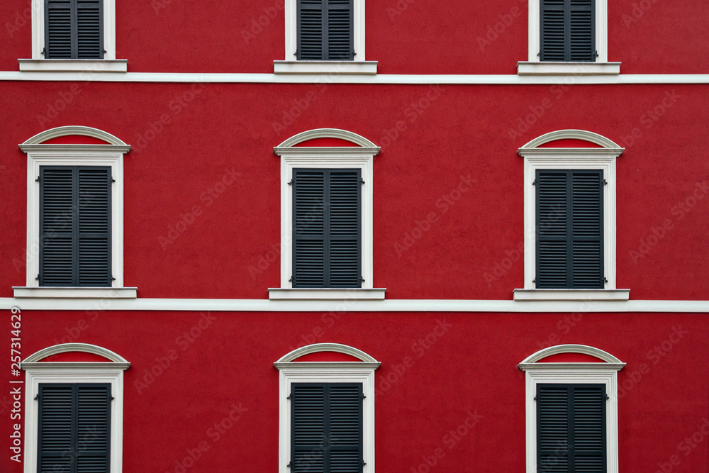 Fototapeta premium Typical building facade red and white color with windows in La Spezia, Italy