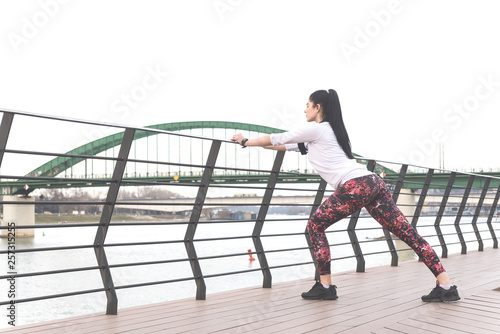 Sporty woman stretching