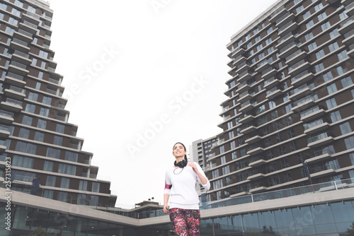 Sporty young woman running in the city © focusandblur