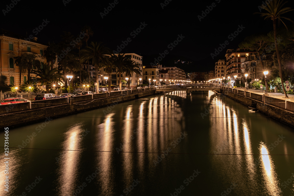 Night river channel of Rapallo town, Liguria, Italy