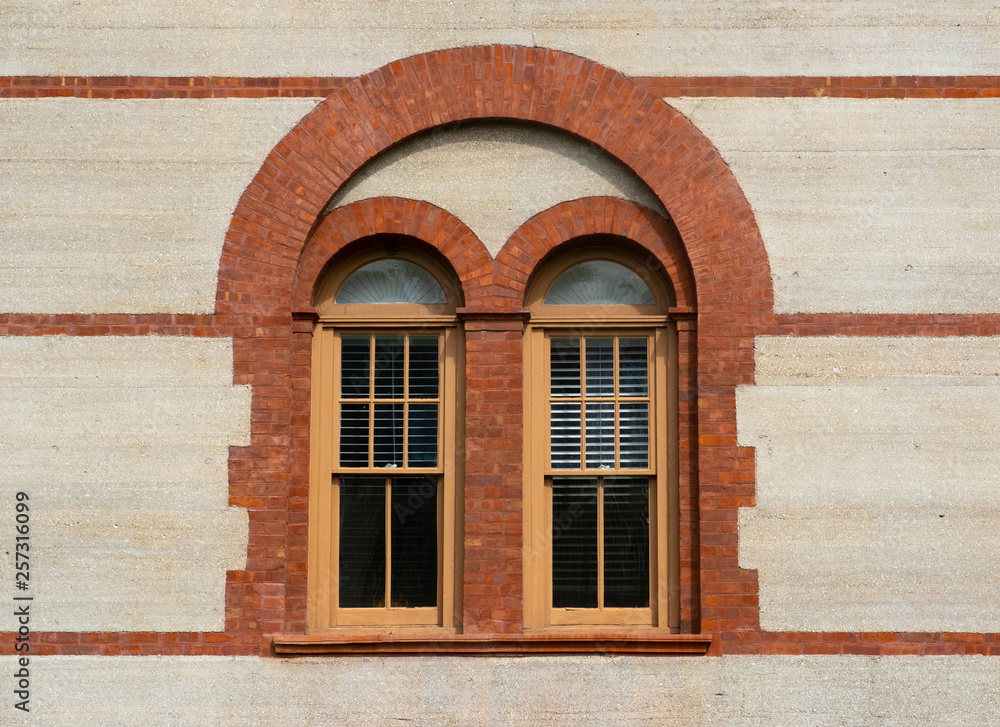 Windows with a brick archway architectural look