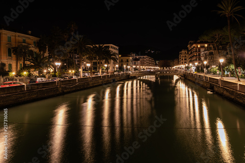 Night river channel of Rapallo town, Liguria, Italy