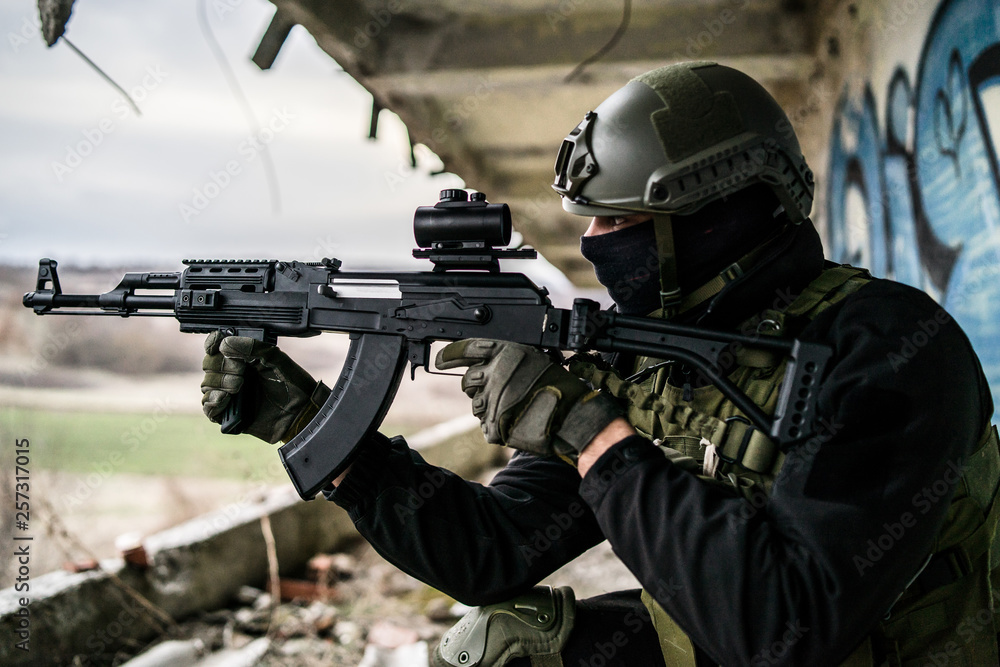Special forces police soldier training in ruined building airsoft SWAT terrorist aiming Special forces police soldier training in ruined building airsoft SWAT terrorist aiming