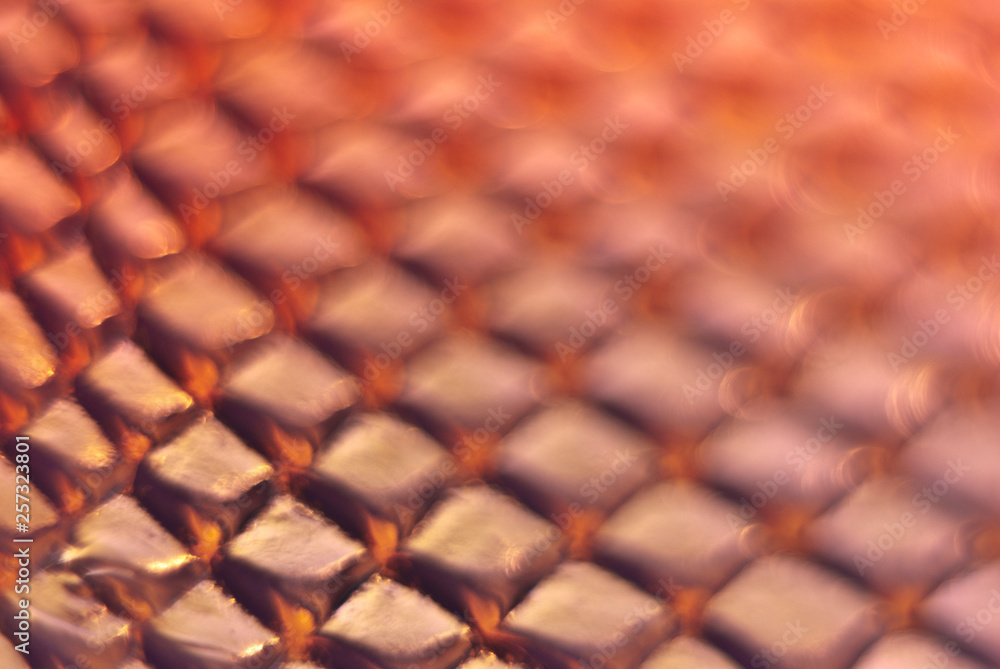 Blurred snake skin background. Bokeh. Holographic texture. Blurred snake skin background. Bokeh. Holographic texture.