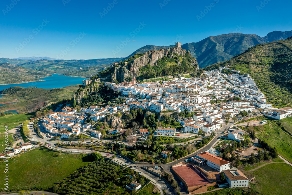 Obraz premium Zahara de la Sierra aerial view of medieval castle, hilltop village and lake near Sevilla Spain