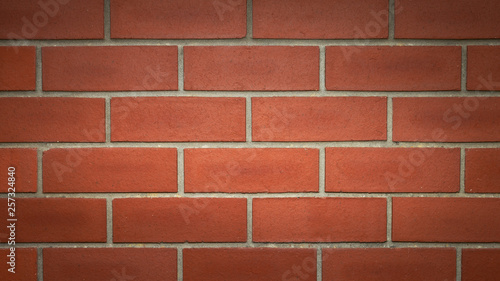 Red brick wall. Close up brick wall texture. Brick wall background. Texture overlay. Surface background. Lots of space for text. Brick pattern.