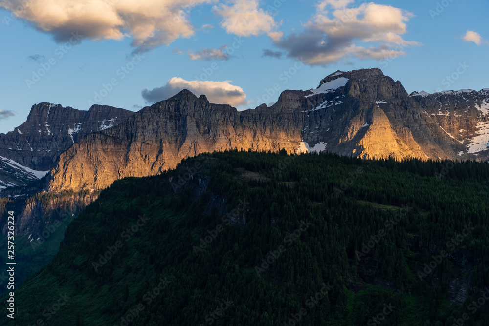 Naklejka premium Evening Light Burns On Mountain Wall