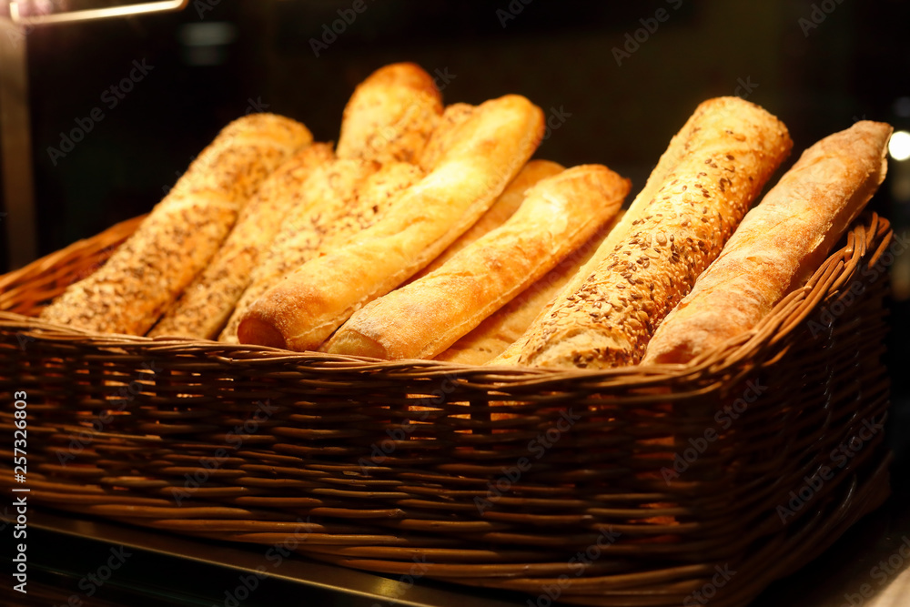 basket with bread sticks on bakery counter basket with bread sticks on bakery counter