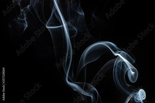 Smoke swirls on black background