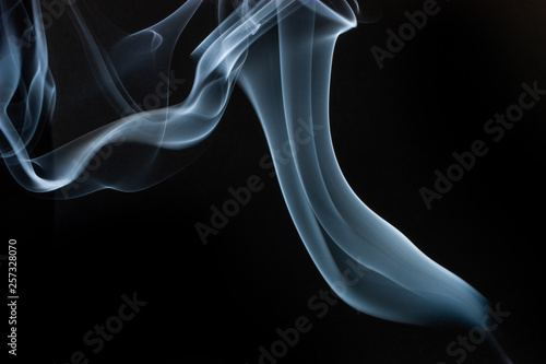 Smoke swirls on black background