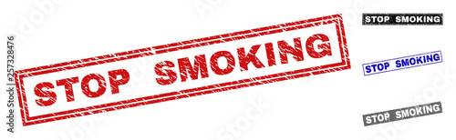 Grunge STOP SMOKING rectangle stamp seals isolated on a white background. Rectangular seals with grunge texture in red, blue, black and gray colors.