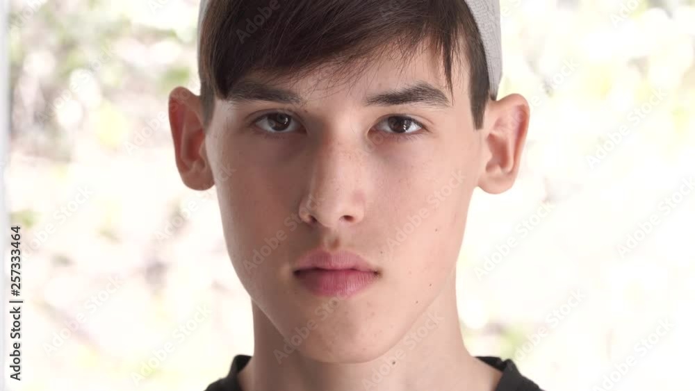 Arab muslim teen with traditional Islamic kufi hat. Spiritual education. Madrasa religious school or college for the study of the Islamic religion Arab muslim teen with traditional Islamic kufi hat. Spiritual education. Madrasa religious school or college for the study of the Islamic religion