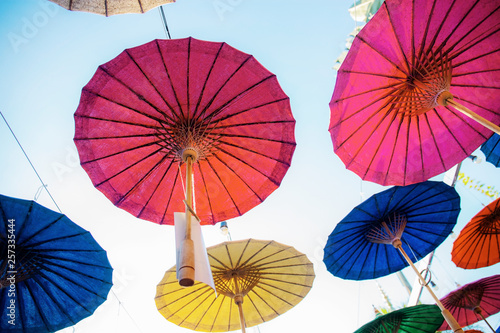 Umbrellas hanging on the sky.