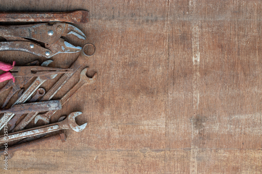 old tools on wooden background old tools on wooden background