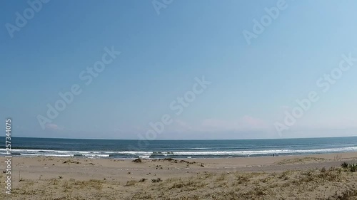 Car window with sandy beach