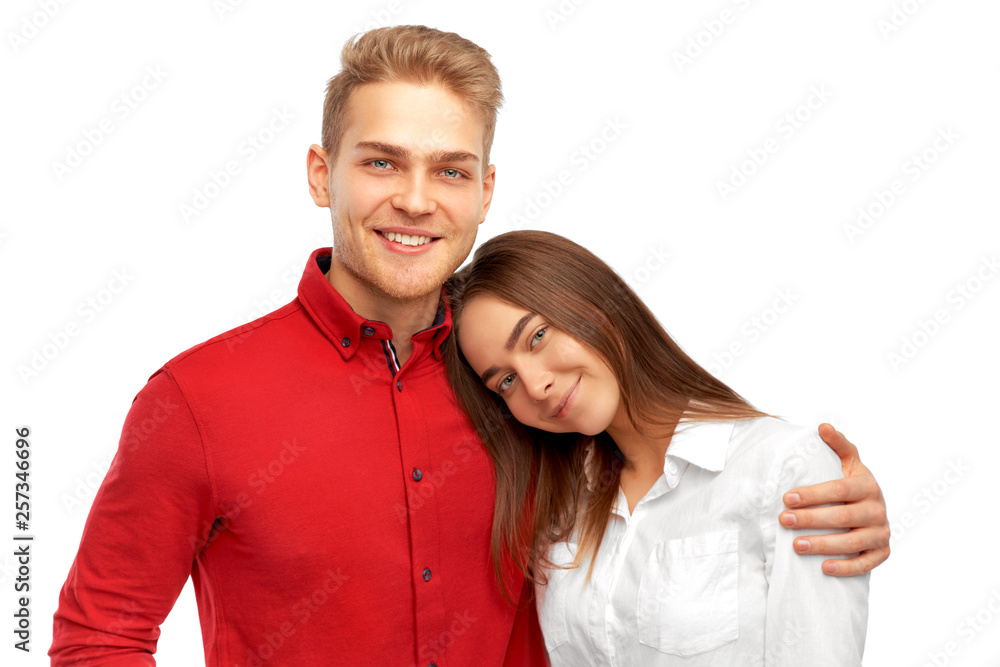 Joyful friends being in good mood after noisy party, stand closely, smile broadly, laugh at good joke. People pose together against white wall in studio Joyful friends being in good mood after noisy party, stand closely, smile broadly, laugh at good joke. People pose together against white wall in studio