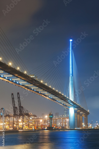 Cargo port and bridge in Hong Kong city at night