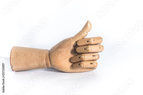 Wooden hand on a white background. With copyspace.